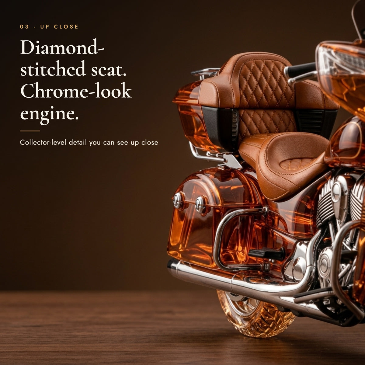 Close-up of the quilted leather-look seat and chrome-look engine of the motorcycle decanter