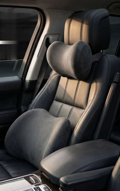 Neck and lumbar pillows on a car seat